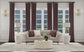 Ellorie - Upholstered Channel Back Curved Sofa - Beige